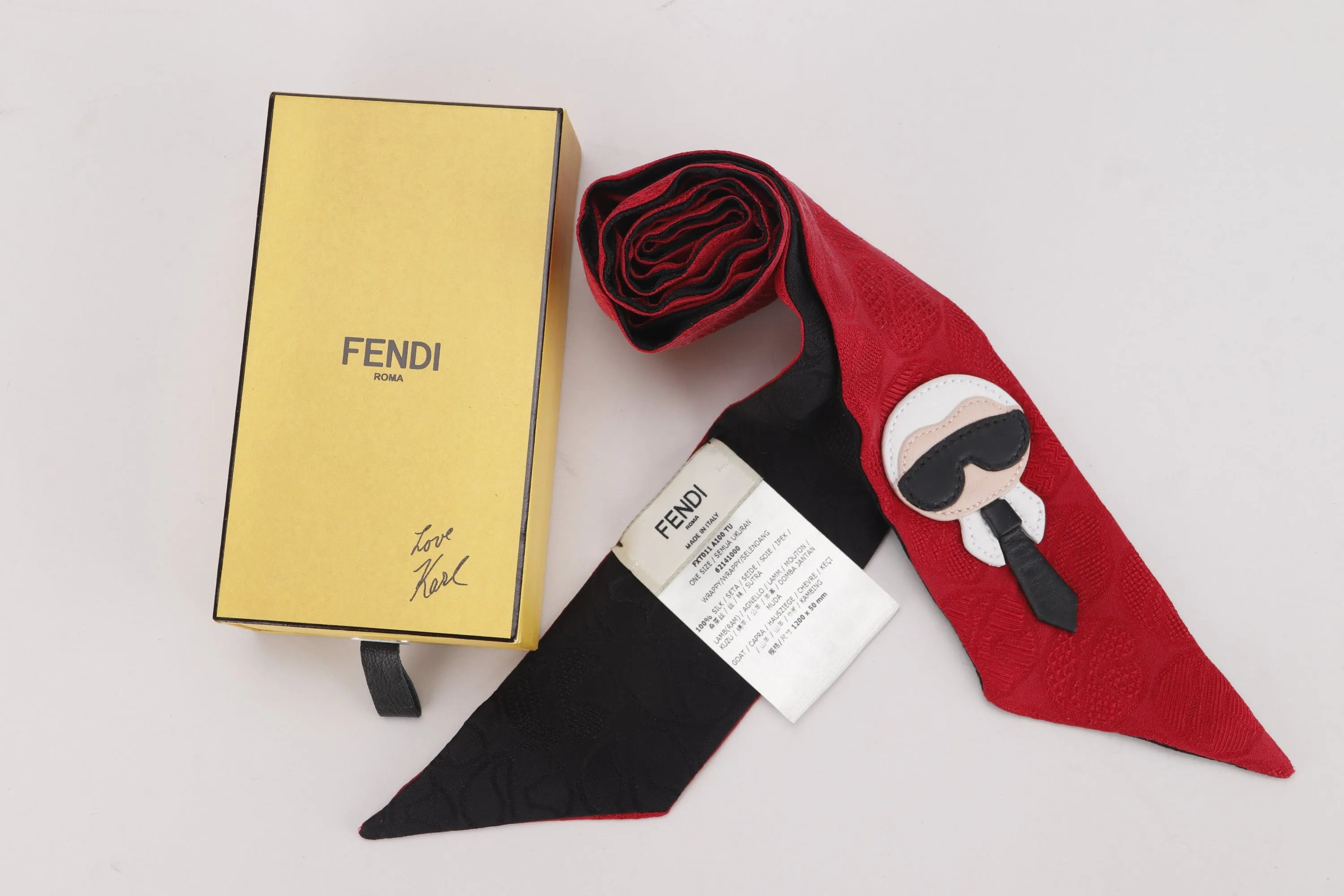 FENDI FXT 011 AIDO TU SILK WRAPPY IN RED & BLACK KARL ICON, SIZE 1200 X 50MM, WITH BOX